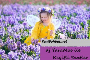 Beautiful girl playing in blooming hyacinth flower field. Kids princess birthday party with fairy costume, butterfly wings and magic wand. Children play in spring flowers. Child picking hyacinths.